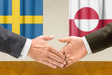 Symbolic cooperation concept &ndash; Sweden and Greenland handshake