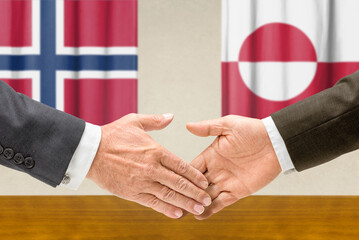 Symbolic cooperation concept &ndash; Norway and Greenland handshake