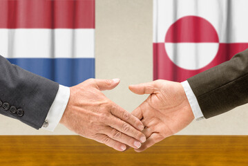 Symbolic cooperation concept &ndash; Netherlands and Greenland handshake