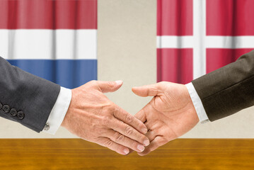 Symbolic cooperation concept &ndash; Netherlands and Denmark handshake