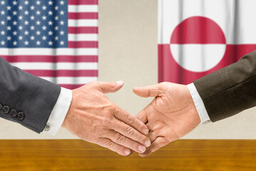 Symbolic cooperation concept &ndash; US and Greenland handshake