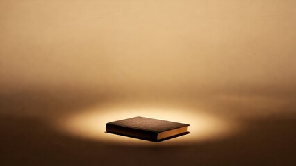 Minimalist book under warm spotlight symbolizing knowledge sharing reading culture and generosity for International Book Giving Day celebration
