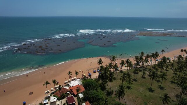 Natural pools in the sea off Taipu de Fora beach, a tourist spot on the Mara&uacute; Peninsula, coast of Bahia, Brazil, panoramic aerial view, coconut trees, blue and green sea, paradisiacal