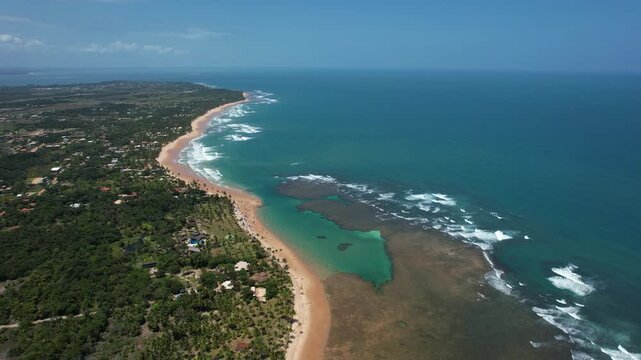 Natural pools in the sea off Taipu de Fora beach, a tourist spot on the Mara&uacute; Peninsula, coast of Bahia, Brazil, panoramic aerial view, coconut trees, blue and green sea, paradisiacal