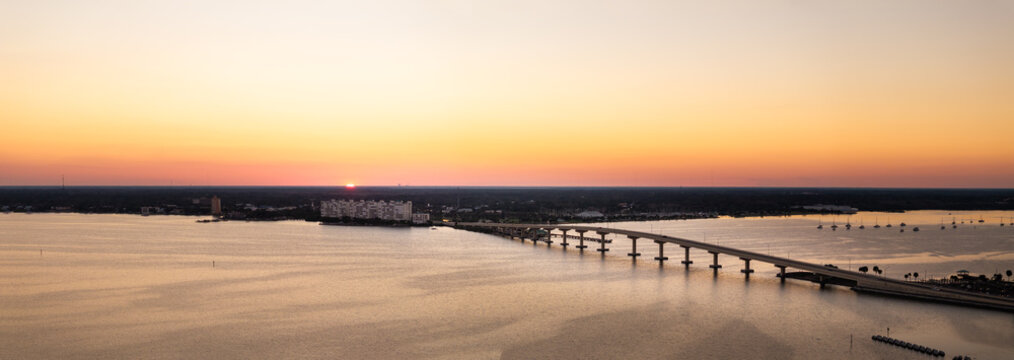  Aerial panoramic view of the Intracoastal Waterway in Titusville Florida along the Indian River Lagoon at golden hour