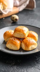 Delicious Homemade Buns on a Plate - A Culinary Delight.