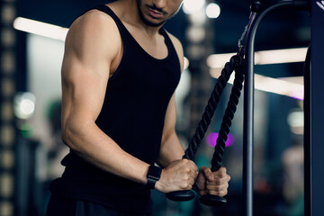 Bodybuilding Concept. Closeup Shot Of Young Muscular Man Working Out Biceps On Fitness Machine At...