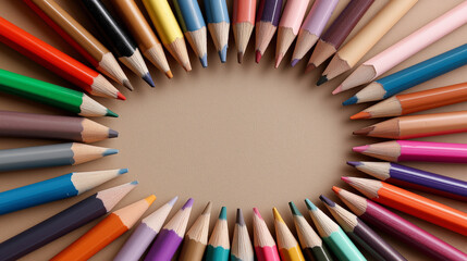 Rainbow of Colored Pencils in a Circle on Brown Background