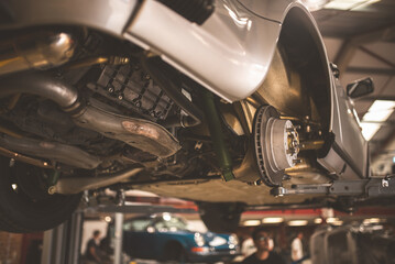 Classic sports car undergoing maintenance in a professional auto repair shop © Pavel Babic