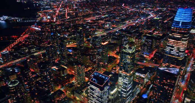 Jaw-dropping panorama of San Francisco, California, USA at night. Metropolis scenery with hectic traffic on roads. Aerial view.