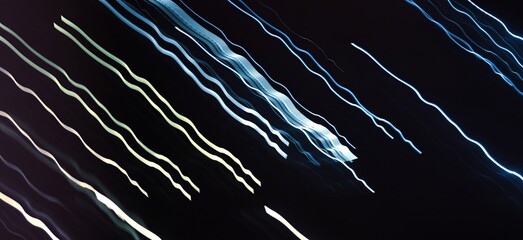 Linear composition. Аbstract long-exposure photograph depicting colorful neon light trails against a dark background.