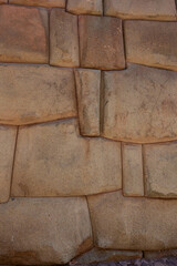 close-up shot showcases the remarkable precision of ancient Inka masonry in Cusco, Peru. The image captures the "Imperial style" of stonework, characterized by perfectly fitted, irregular polygonal 