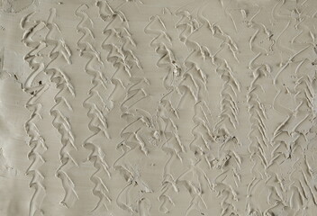 Grey modelling clay with spiral lines background and texture