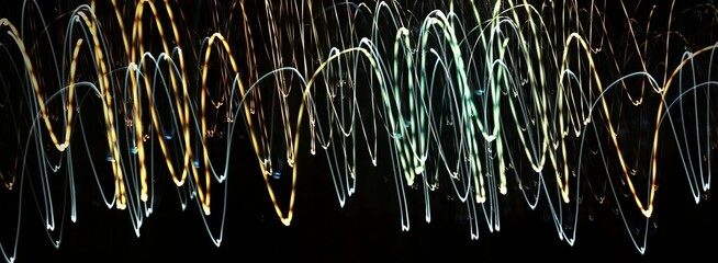 Abstract linear composition. Photography, selective focus, long exposure, dynamic movement. Light lines. Texture. Background. Cover. Wrapper.