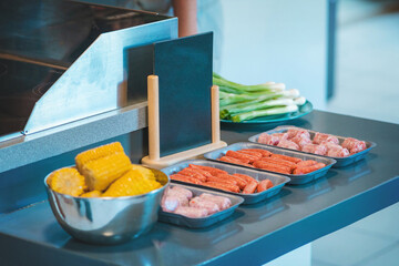 Cold meats and sausages arranged on plates, copy paste