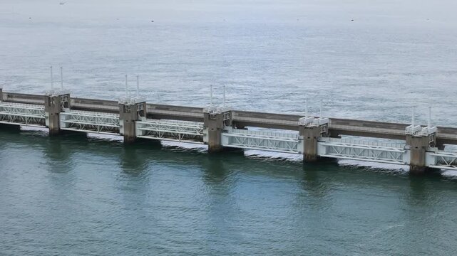 complex architectural arrangement intricate white metal support trusses colossal concrete piers massive eastern scheldt storm surge barrier aerial shot netherlands 