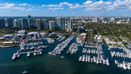 Aerial view of boat marina with city buildings in the background