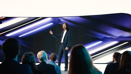 Asian chief product officer does new product presentation for mobile technology, modern design...