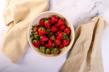 Top view of a container with fresh strawberries.