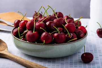Close-up of a deep dish of cherries.