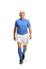 Fototapeta premium Full length shot of a senior man in a blue football jersey and white shorts