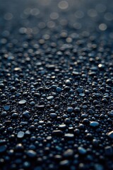 Close-up of textured asphalt, showing fine & coarse aggregate, texture background, close up