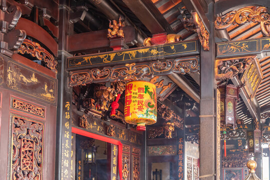 Ornate Interior of Carved Wood and a Lamp in Ancient Buddhist Temple in Malacca Malaysia