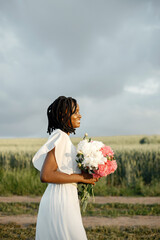 Portrait of beautiful black woman with flowers