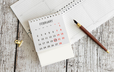 Minimalist white wooden block perpetual calendar displaying FEBRUARY 20