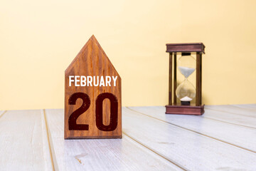Minimalist white wooden block perpetual calendar displaying FEBRUARY 20