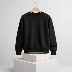 Stylish Black Sweatshirt on Display with Minimalist Background in Modern Studio Environment