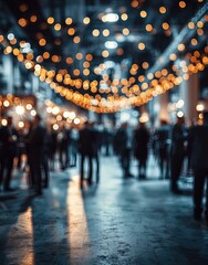 People walking under string lights in a venue