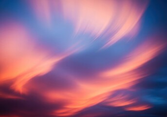 Fototapeta premium Abstract atmospheric background showing smooth, flowing motion of clouds and vibrant colors at dusk or dawn, suitable for digital design, smooth, flow, curve