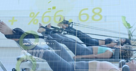 Lying women in sportswear doing reformer pilates in bright studio, with foot straps, HUD