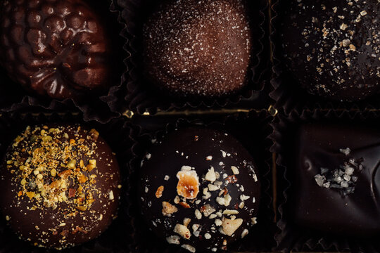 top down view of fancy chocolate truffles in box