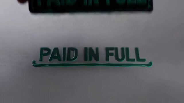 Paid in Full stamp on white paper with green ink  