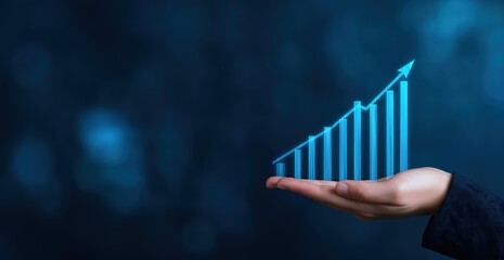 Hand holding an increasing bar graph with an upward arrow showing progress and positive business growth on a blue background