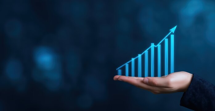 Hand holding an increasing bar graph with an upward arrow showing progress and positive business growth on a blue background - Powered by Adobe