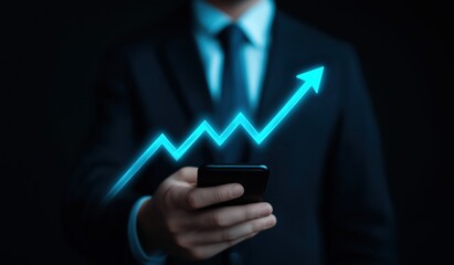 Businessman in a suit holding a smartphone with a glowing blue upward arrow, symbolizing financial growth and business success
