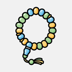 Obraz premium A colorful Islamic prayer beads or tasbih with a tassel, isolated on a white background.