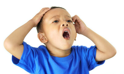 Asian little boy showing confused, defeated, shocked, surprised, don't know what to do, can't think, hopeless expression, isolated on white background with blue shirt.