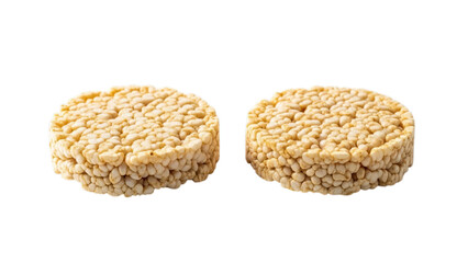 Two round puffed rice cakes on a white background, healthy snack
