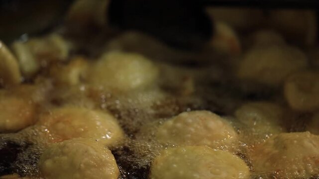 kachori frying in oil. Indian street food.