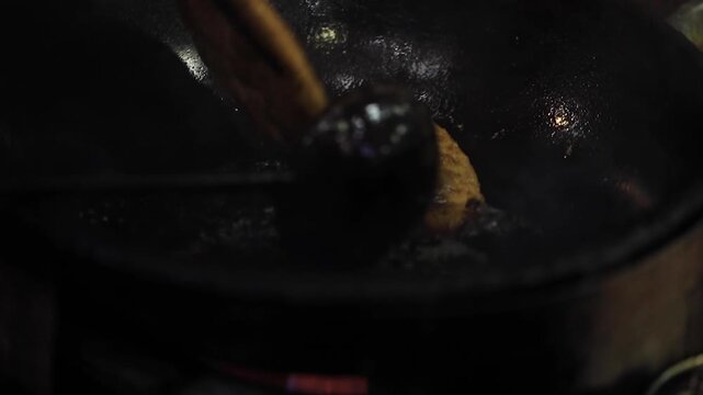 closeup shot of cooking deep fried parantha.