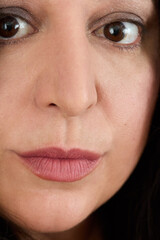 Portrait of a woman in front of a white curtain