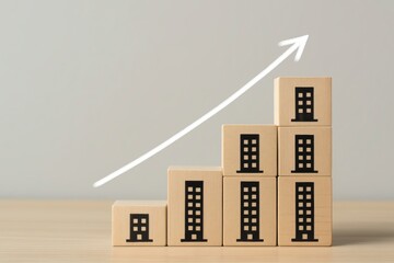 Ascending Architecture of Success: Wooden blocks arranged in a rising staircase, with upward-pointing arrow symbolize the growth and expansion of a business.