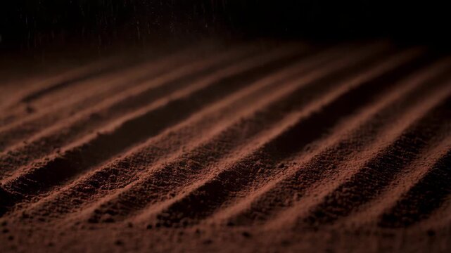 Rows of Brown Powder on a Dark Background with Dim Lighting