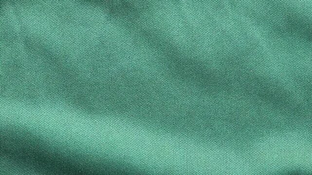 Green sports clothing fabric football shirt jersey texture close up