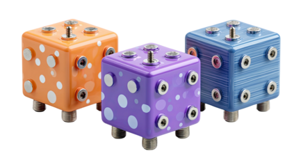 Three colorful, polka-dotted, and striped cube-shaped electronic devices with several plugs
