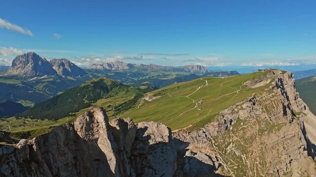 Dolomites, Italy, Seceda Aerial View Panoramic Alpine Ridge Seceda With Winding Trail Snaking Across Green Slopes, Distant Jagged Peaks, Summer Light, Expansive Valley, WideAngle